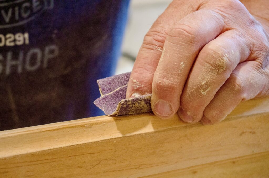 closeup-of-manually-sanding-of-wood-with-sandpaper-2022-11-16-00-05-02-utc-1024x6792.jpg